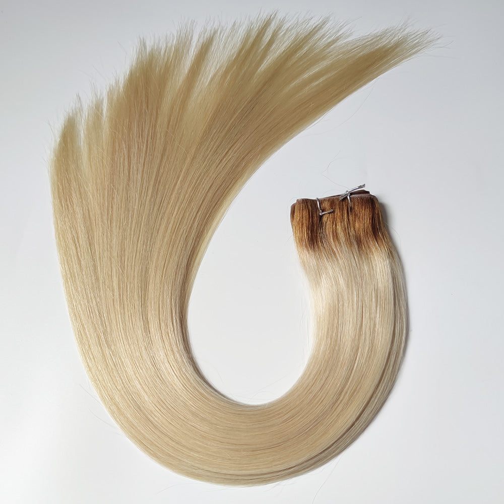 Brown root platinum blonde XO invisible wefts